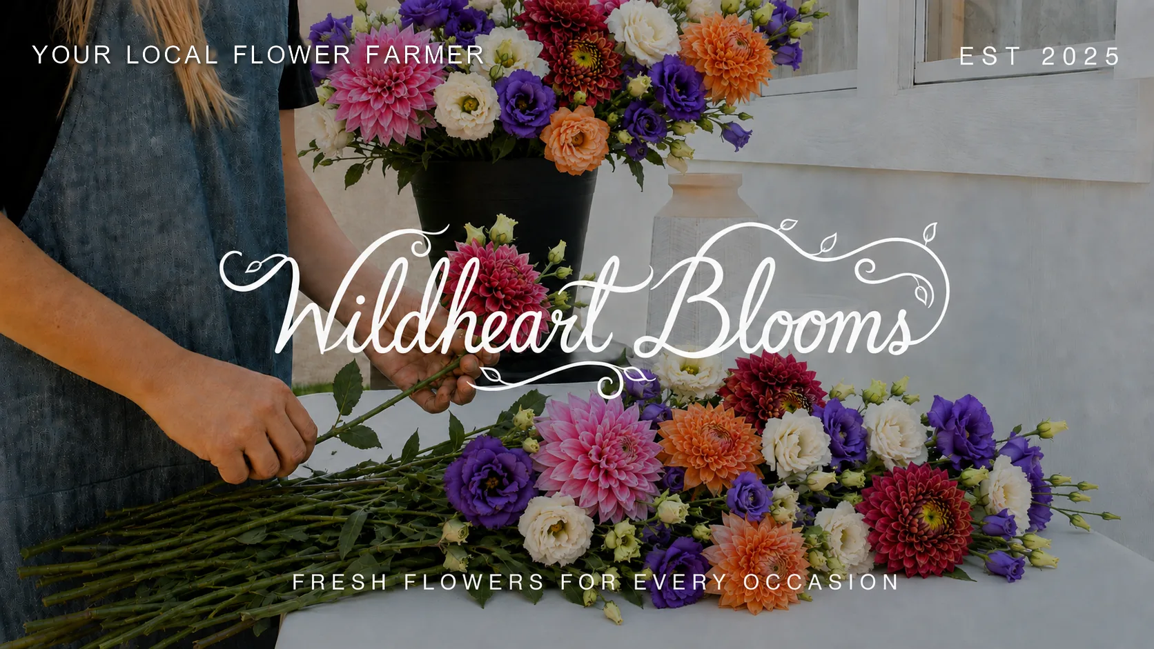 Sha'ree, your local flower farmer, arranging dahlias and lisianthus at a flower-filled worktable